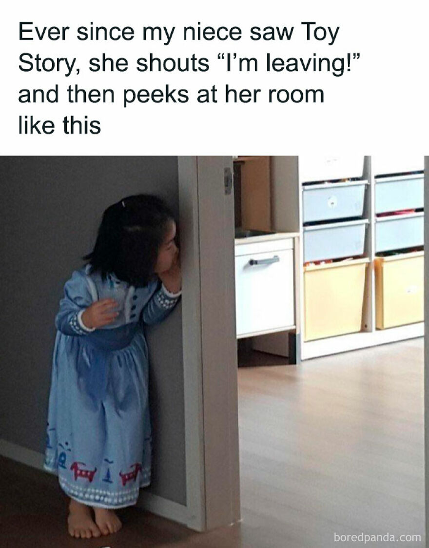 Child peeking around corner in playful moment, perfect for funny memes about being one inconvenience from a full meltdown.