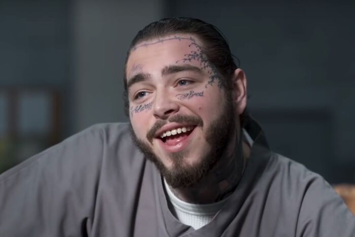 Smiling man with face tattoos in a casual setting, illustrating fascinating today I learned posts about new facts.