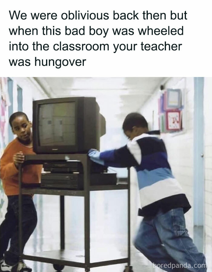 Two boys wheeling a vintage TV cart down a school hallway in a post celebrating the good old 80s nostalgia.