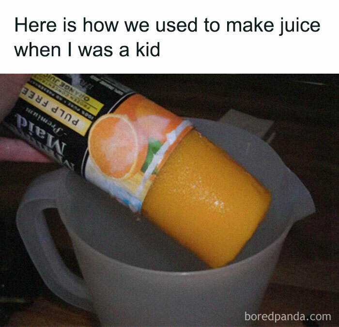 Making nostalgic juice from frozen orange concentrate poured into a clear plastic measuring cup, childhood memories.