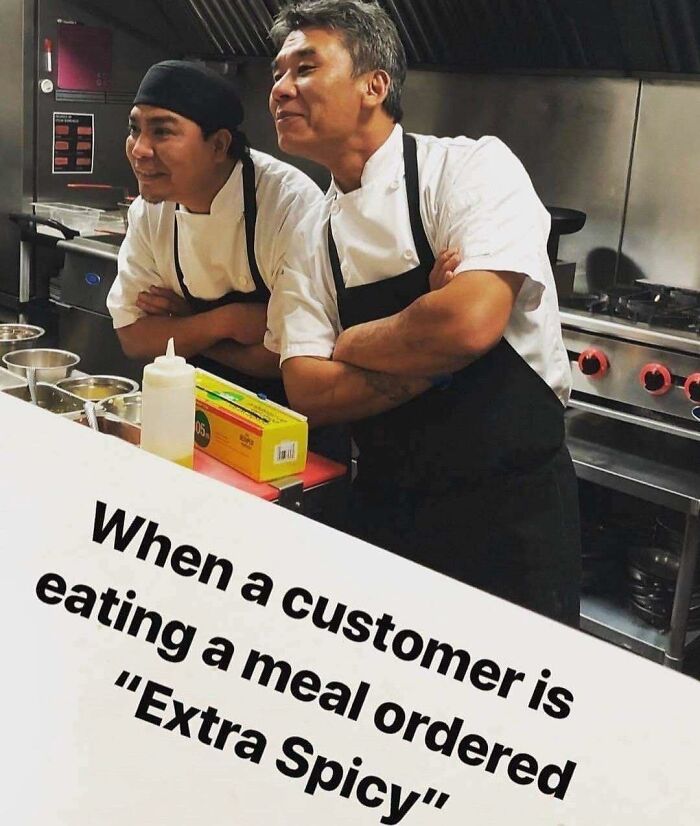 Two chefs in a kitchen looking amused with arms crossed, relatable hospitality memes about customer meal orders.