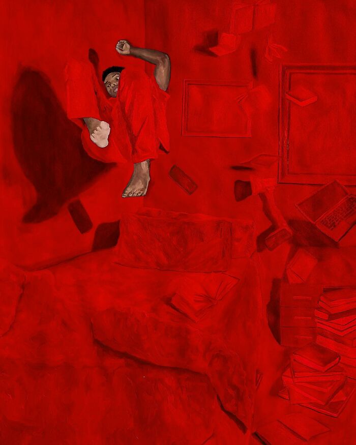 Person curled up in red room with scattered items, highlighting the explanation of colours, space, and identity in art.