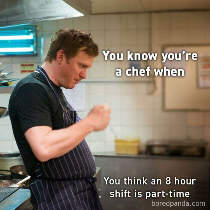 Chef in a busy kitchen meme humor about working in hospitality describing long shifts and part-time expectations.