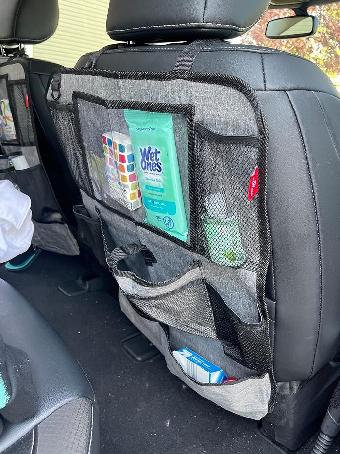 Car organizer accessory attached to backseat, holding wipes, hand sanitizer, and other items, enhancing your car’s look and function.