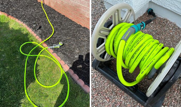 Bright green garden hose neatly coiled on a reel and stretched out on lawn next to garden bed with mulch.