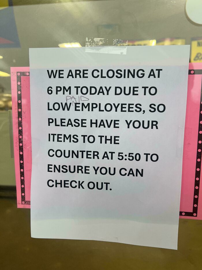 Sign on a store window about early closing due to low employees, an example of wholesome vandalism improving streets.