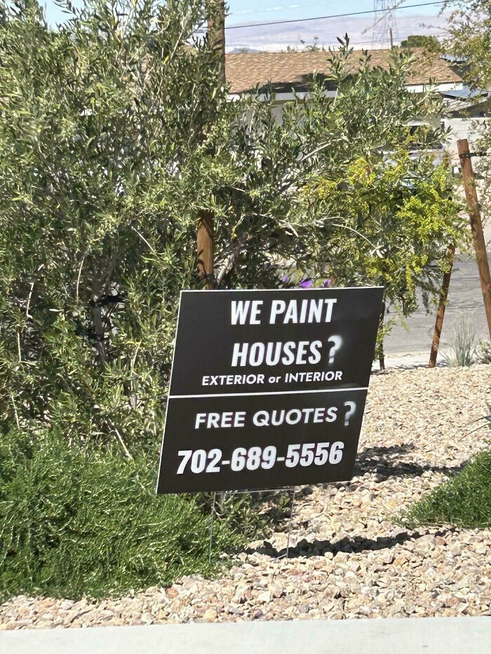 Street sign with paint job promoting house painting and free quotes, an example of wholesome vandalism improving streets.