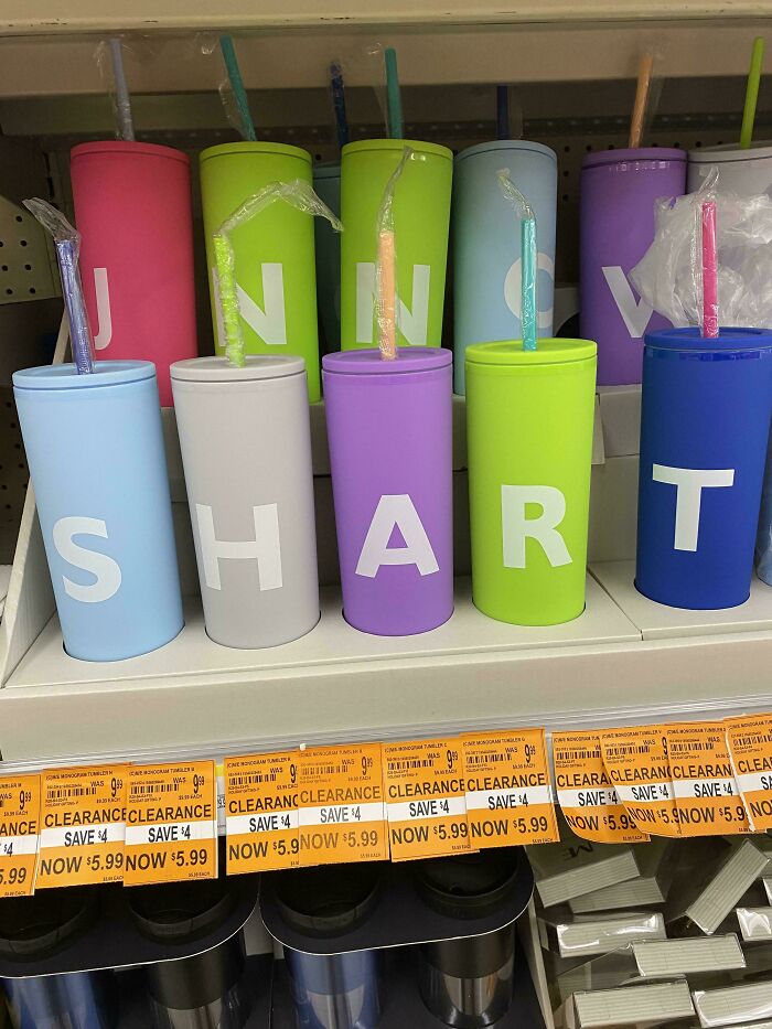 Colorful tumblers arranged to spell a humorous word, showcasing creative wholesomeness in street-style design.