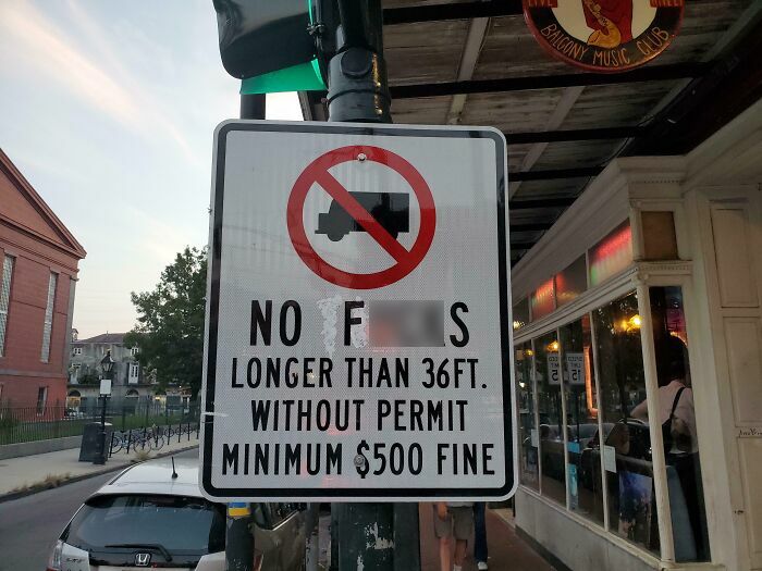 Street sign altered by wholesome vandals to improve the look and feel of urban streetscape with humor and creativity.