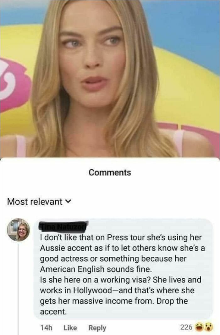 A woman reacting to a social media comment showing ignorance of Americans about accents and visas.