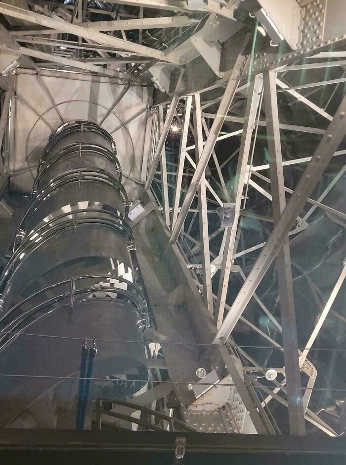 Interior view of Eiffel Tower structural metal beams and staircases showing alternate angles of iconic historical architecture.