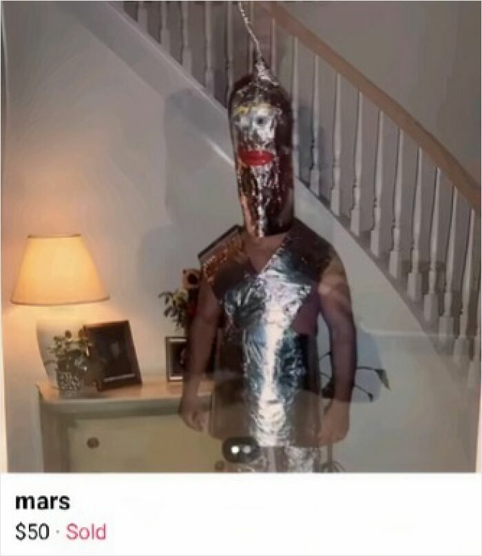 Person wearing a homemade costume made of aluminum foil listed for sale on Facebook Marketplace in a humorous screenshot.