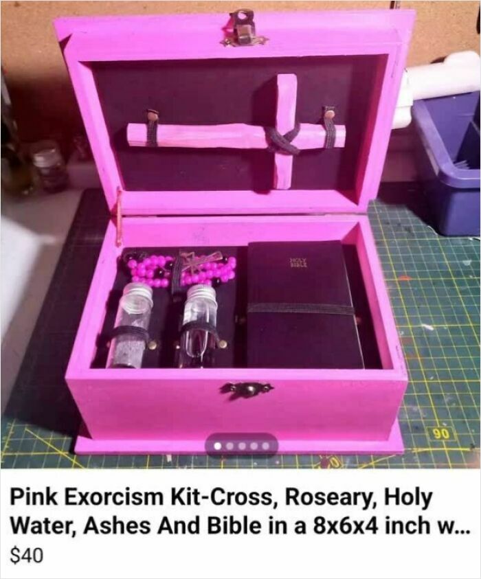 Pink exorcism kit with cross, rosary, holy water, ashes, and Bible displayed for sale on Facebook Marketplace.