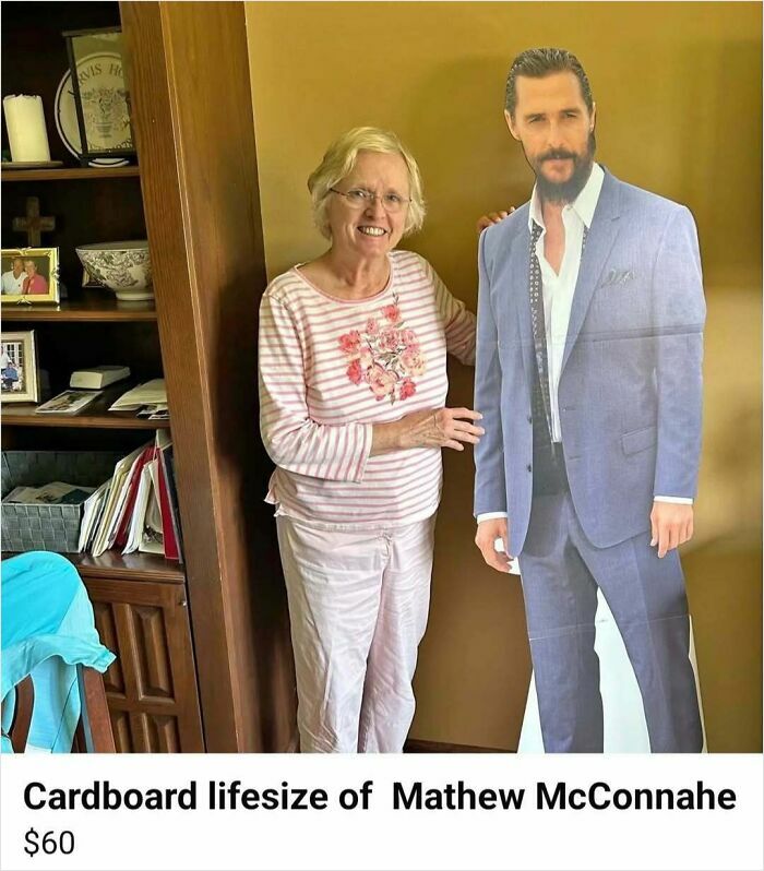Elderly woman smiling next to a cardboard lifesize cutout of Matthew McConaughey listed on Facebook Marketplace for sale.