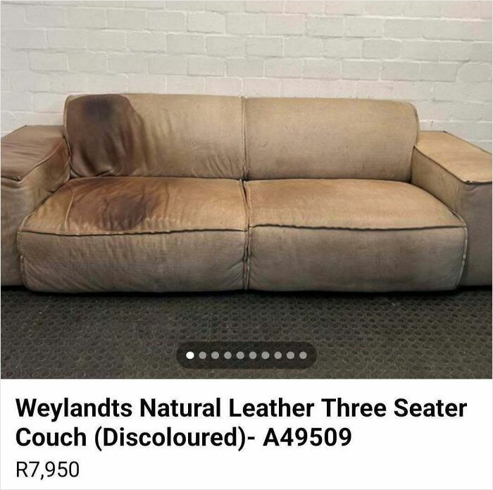Worn and discolored natural leather three-seater couch listed on Facebook Marketplace with visible stains and damage.