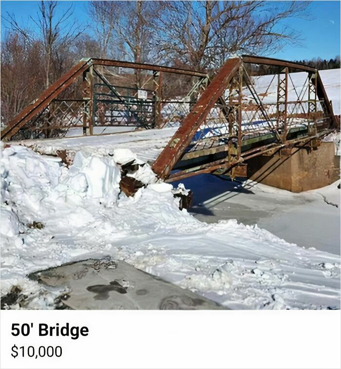Rusty old 50-foot bridge listed for sale on Facebook Marketplace with snow-covered ground and leafless trees.