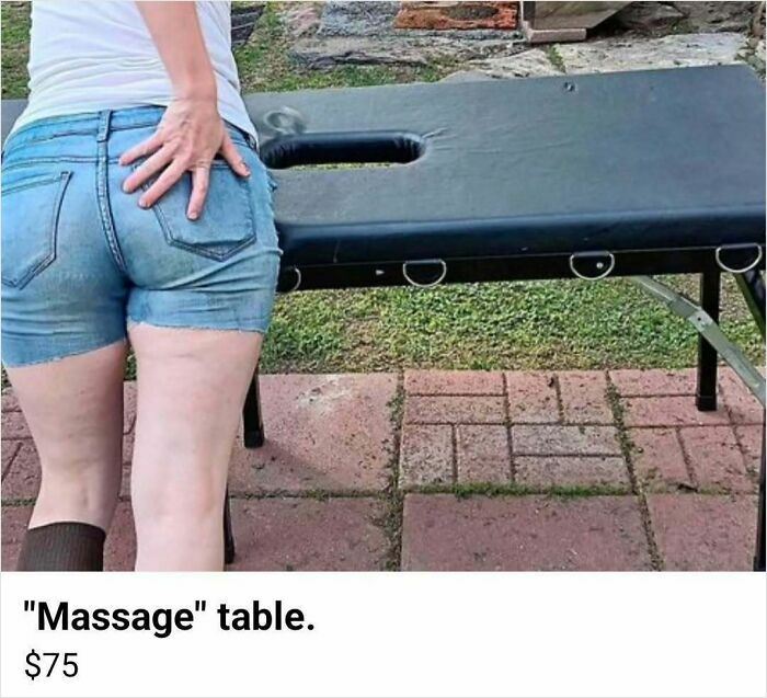 Person in denim shorts standing next to a used massage table listed on Facebook Marketplace for sale.