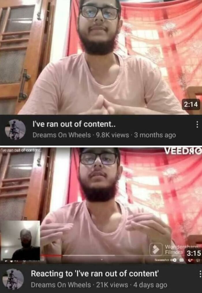 Young man with glasses and beard reacting to video content in a cluttered indoor setting, blursed images concept