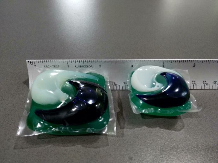 Two detergent pods placed on a table next to a ruler, illustrating everyday life in the US through American perspectives.