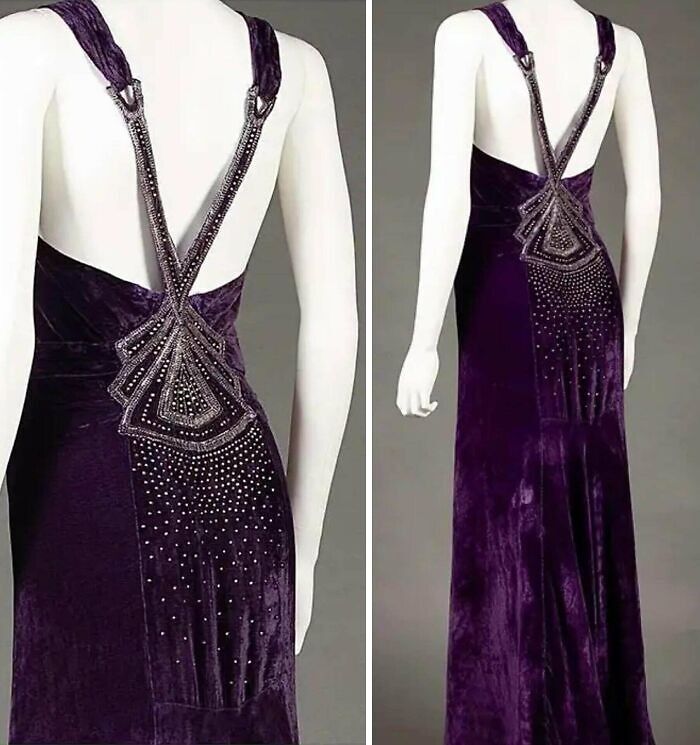 Vintage deep purple velvet dress with intricate beaded straps and detailed back design, showcasing centuries of fashion evolution.