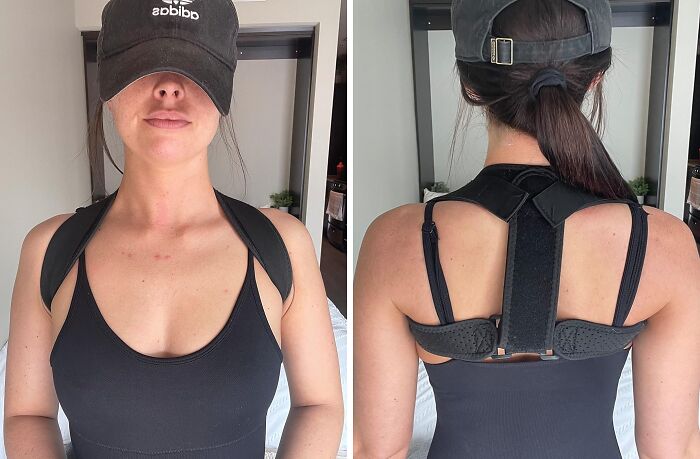 Woman wearing a black posture corrector device and black tank top, showcasing a weirdly wonderful find for improved back support.