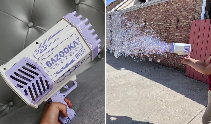 Bazooka bubble gun held in hand and used outdoors, creating a large stream of bubbles in a sunny setting.