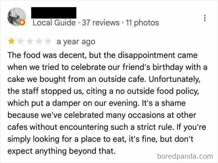 Screenshot of an absurd customer review complaining about a no outside food policy at a cafe.