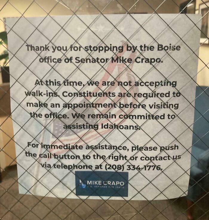 Sign on Boise office window of Senator Mike Crapo about requiring appointments, reflecting current life in the US.