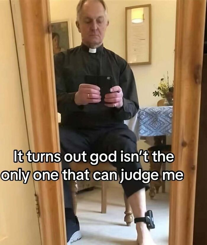 Man in clerical collar taking a mirror selfie with ankle monitor, funny relatable meme about judgment and punishment.