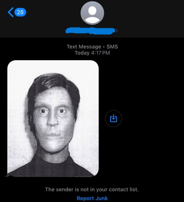 Text message showing a creepy black and white photo of a face with distorted features, shared in a creepy encounter.