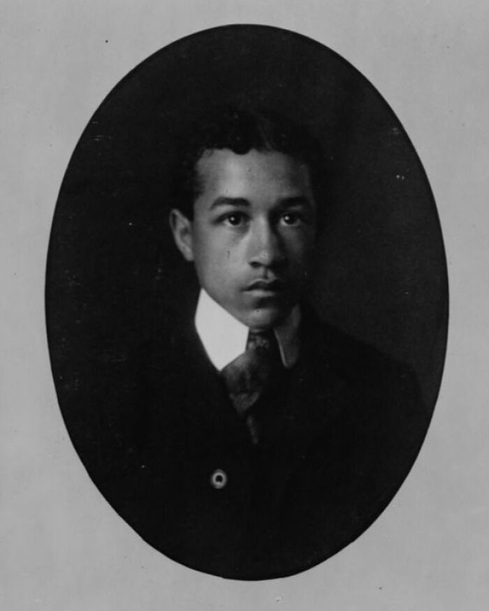 Portrait of a young African American man in formal attire from 1900 Paris Exposition capturing African American life.