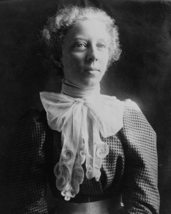 Portrait of a woman in early 1900s attire, representing life captured at the 1900 Paris Exposition.