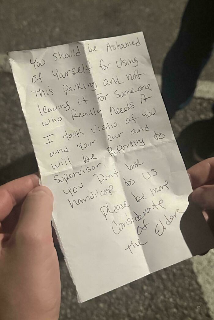 Handwritten angry note about entitled people abusing a parking space, highlighting entitlement and inconsiderate behavior.