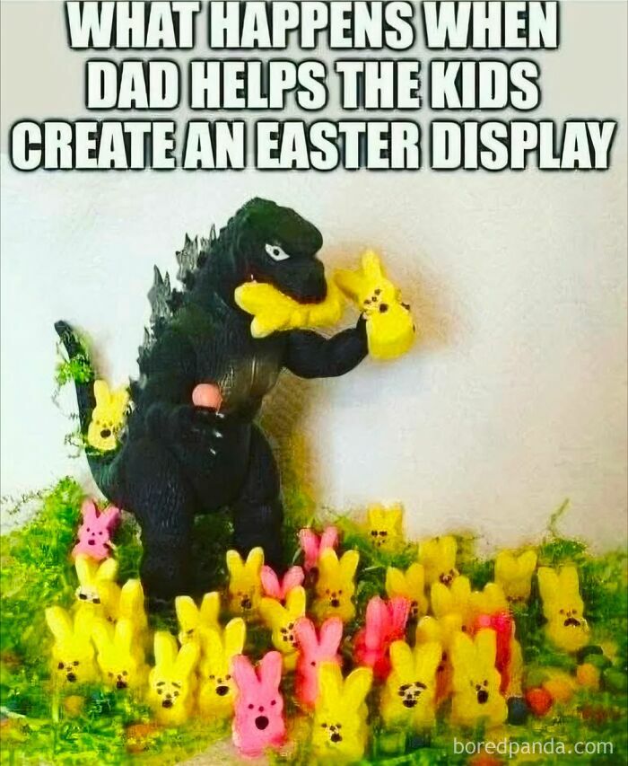 Godzilla toy holding Easter Peeps candy in a humorous dad humor Easter display with colorful marshmallow bunnies.