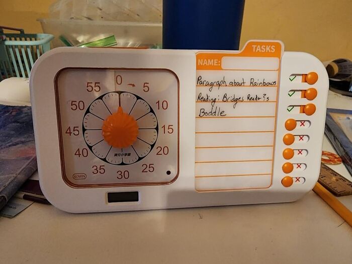 Timer and task organizer on a desk, illustrating tools to hack your way into becoming a morning person effectively.
