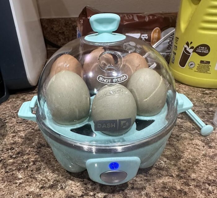 Egg steamer with eggs cooking on a kitchen counter, illustrating hacks to help become a morning person.