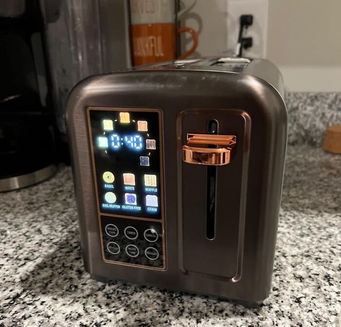 Modern digital toaster on kitchen counter, highlighting one of the best hacks to become a morning person efficiently.