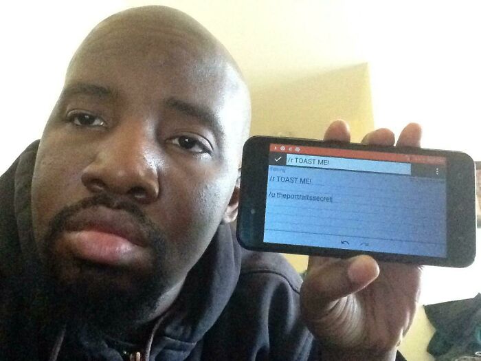 Man holding phone showing a toast request on Reddit, part of 80 people who asked the internet for the nicest comments.