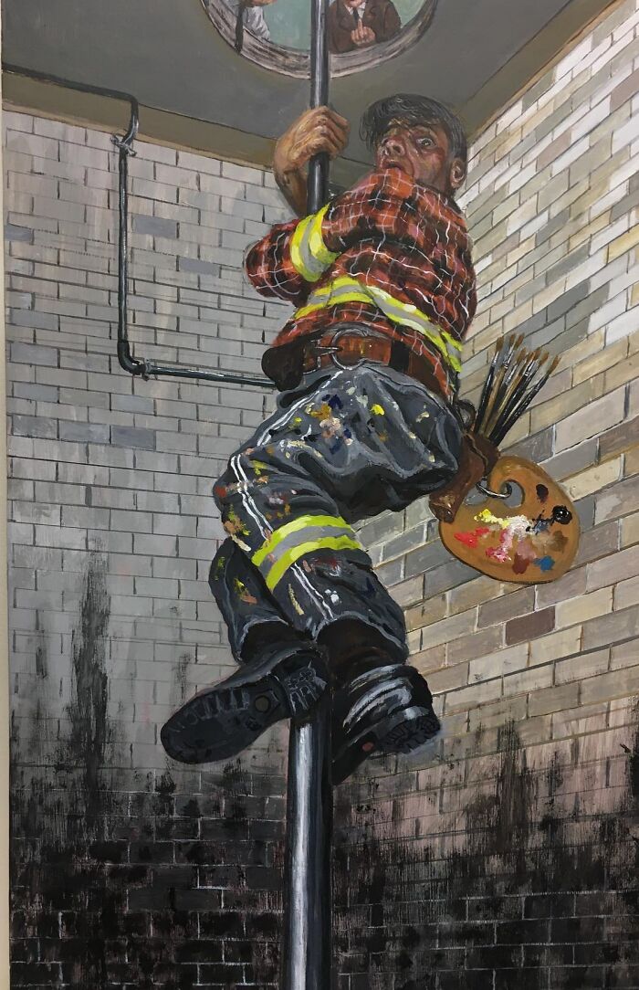 Man climbing pole in grimy stairwell wearing artist and firefighter gear, illustrating humor and social tensions in art.