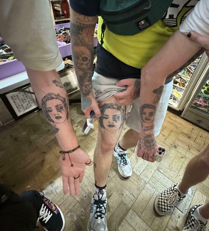 Three people showing matching face tattoos on their arms and leg, illustrating one-in-a-million coincidences.