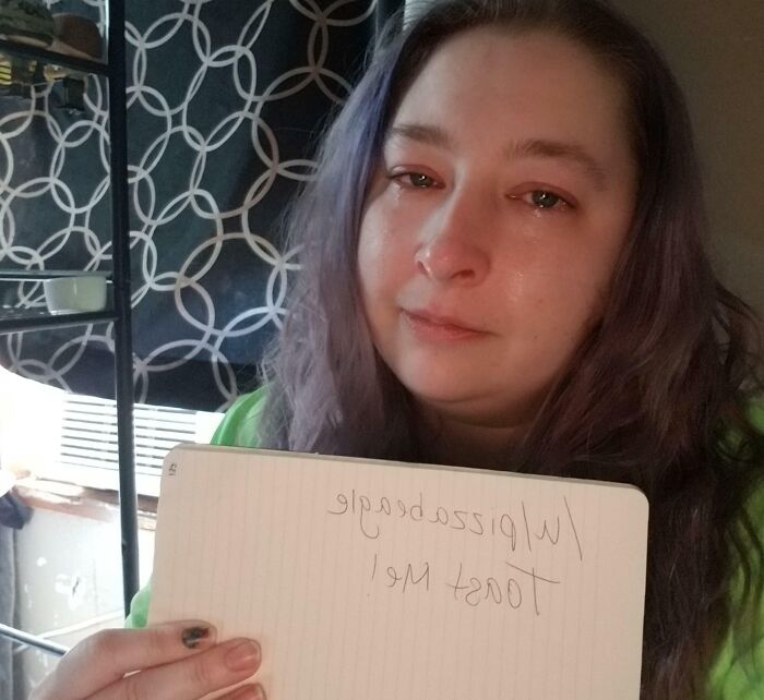 Person holding a notebook asking for a toast, part of the internet toast posts with kind comments and positive vibes.