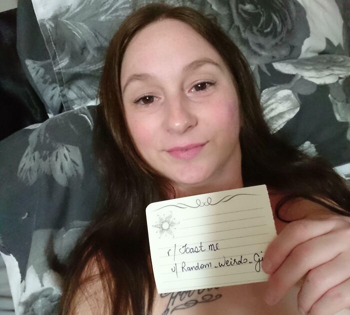 Young woman holding a note asking the internet to toast her, featured in positive and supportive online comments.