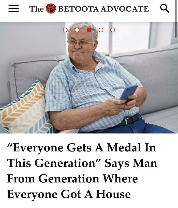 Older man sitting on a couch holding a phone, illustrating bad landlords causing renting frustration and tenant challenges.