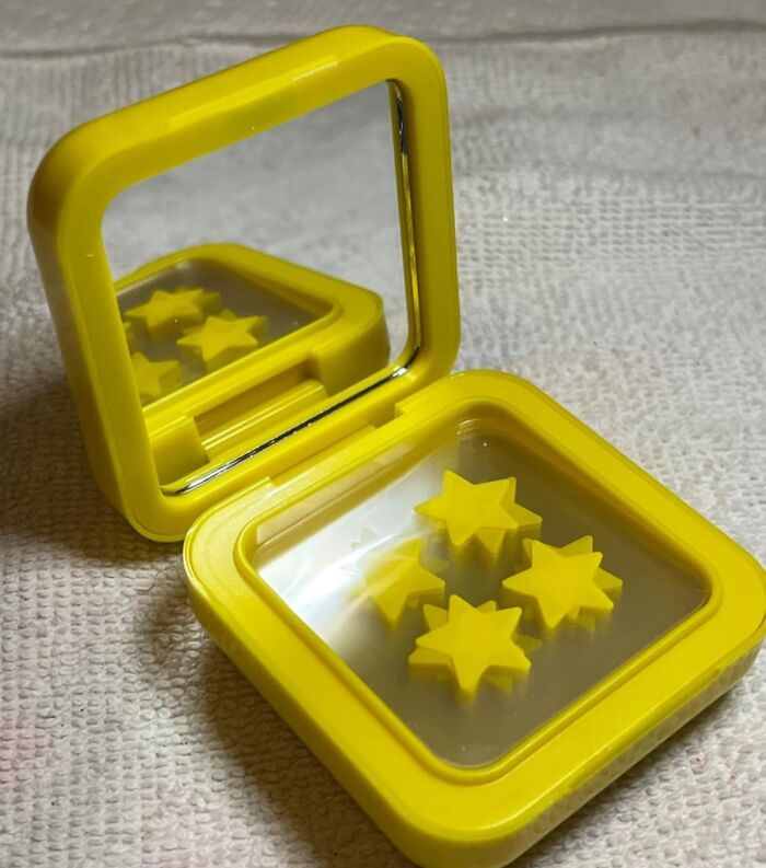 Yellow compact mirror with star-shaped objects inside, featured in popular TikTok finds on the For You page.