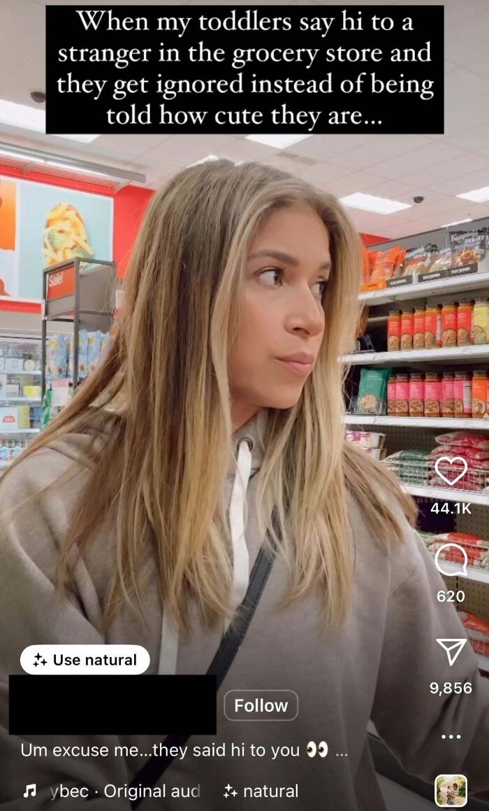 Woman in a grocery store looking annoyed, highlighting entitled parents exposed online for ignoring toddlers' greetings.