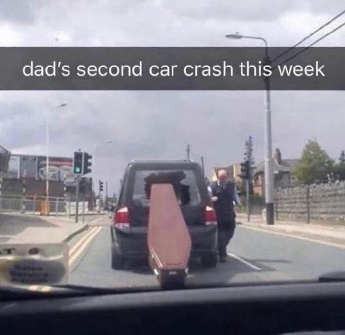 Car with a broken rear window and a coffin attached, humorous random meme for when your brain needs a break.