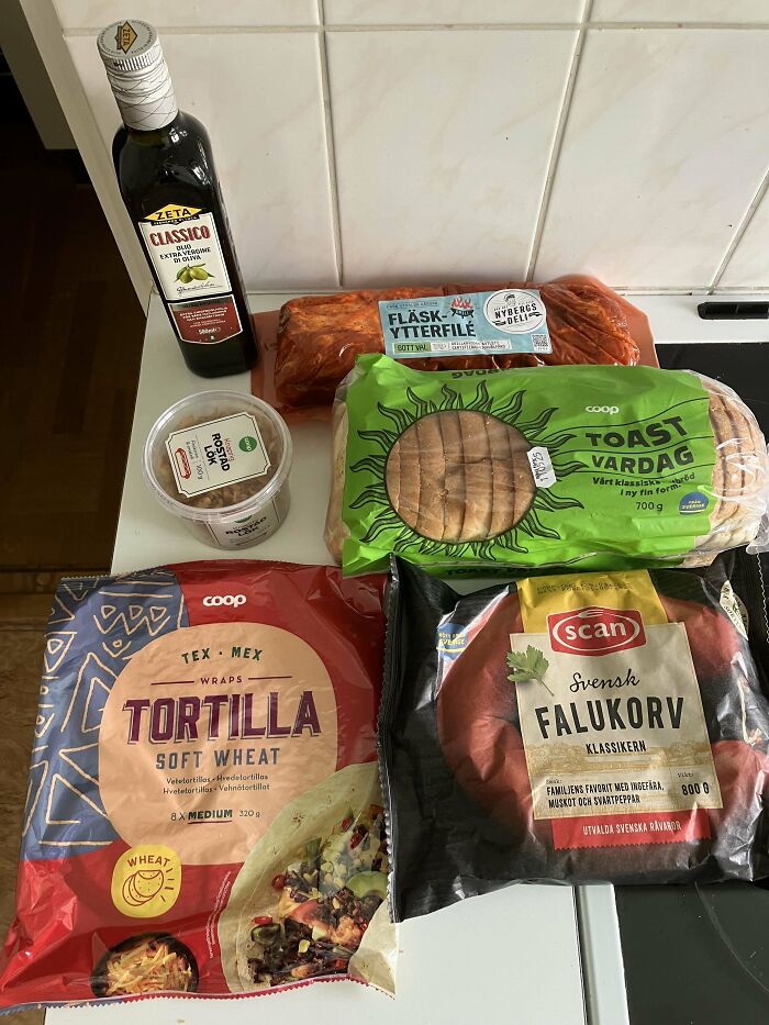 Various grocery items including olive oil, meat, bread, and tortillas displayed to show grocery costs where they live.