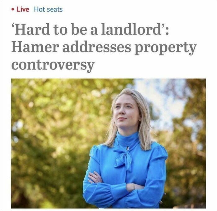 Woman in blue blouse with arms crossed outdoors, symbolizing challenges faced by bad landlords in renting properties.