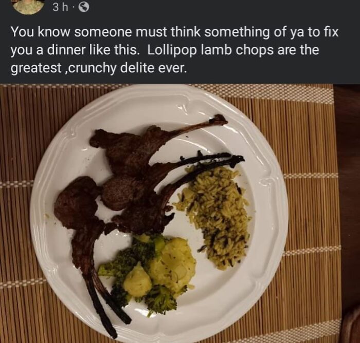 Burnt lamb chops with broccoli, cauliflower, and rice on a white plate, part of cursed food pics trigger warning series.