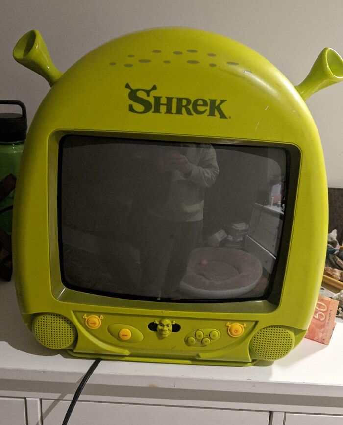 Vintage Shrek-themed TV with built-in speakers and controls, showcasing classic vintage devices and retro technology design.